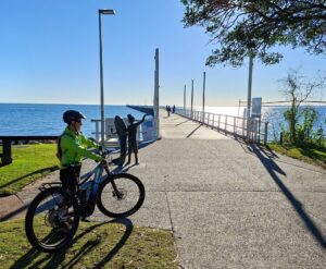 The impressive 868m Urangan Pier and beach at the end of the rail trail, which also connects with coastal pathyways [2025].
